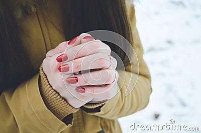 Girls hands in cold in winter day Stock Photo